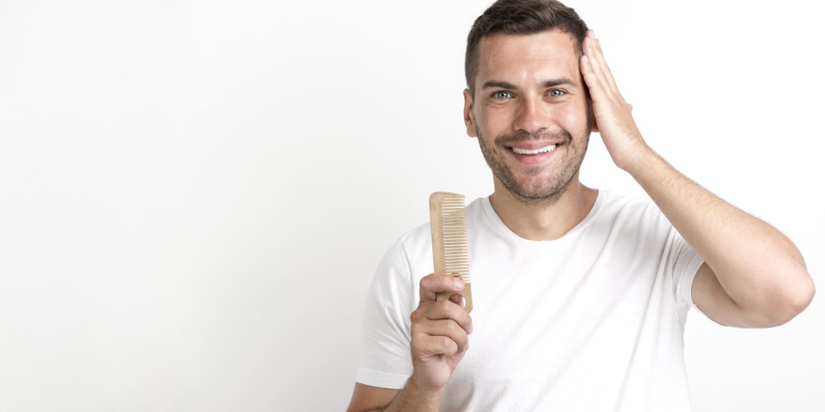 young-man-holding-comb-set-his-hair-against-white-background conditioner